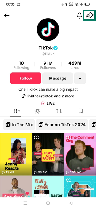 TikTok official profile on iPhone with share arrow icon highlighted in the top-right corner.